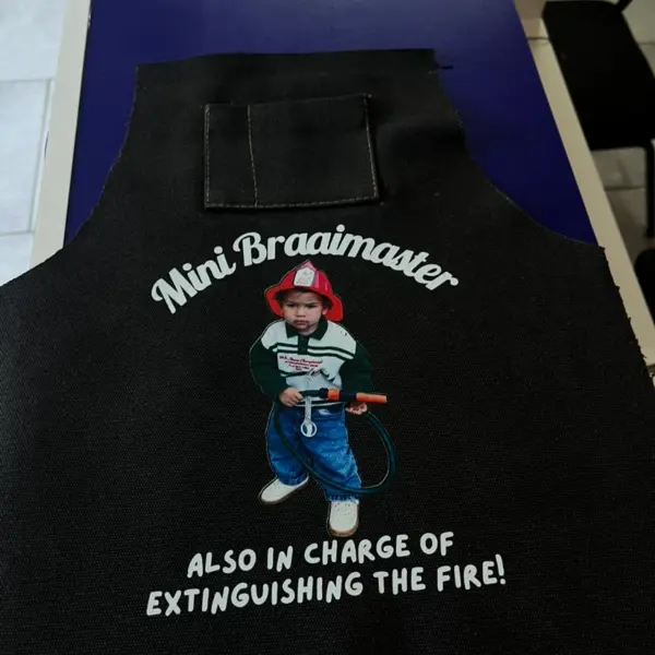 Personalised mini braai apron printed with a photograph and custom wording